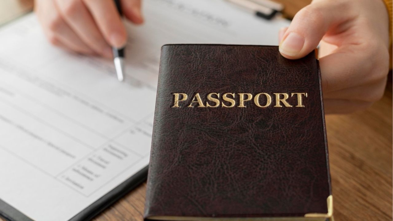 A traveler checks their passport for overstay dates in Thailand.