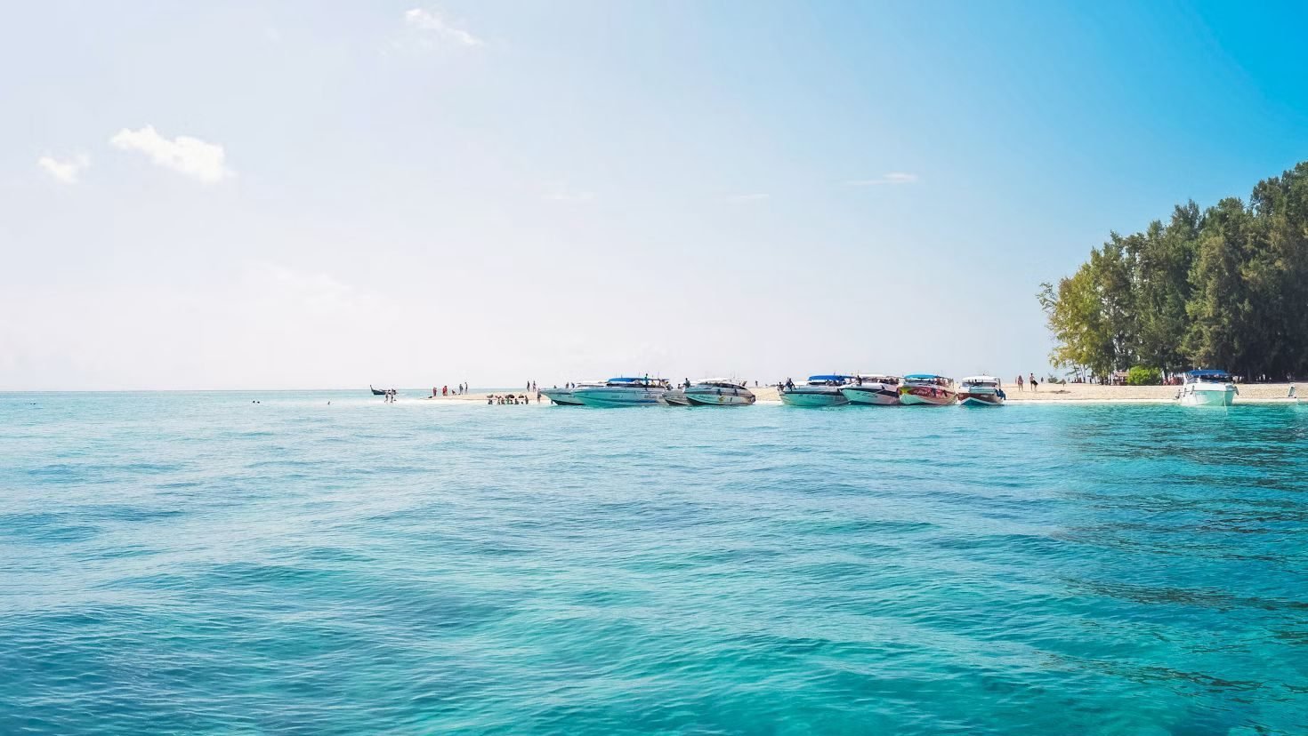 Boats floating on Koh Kood, an island in Thailand