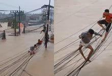 Viral video shows Thai men risking lives on wires during severe Hat Yai flood | Thaiger