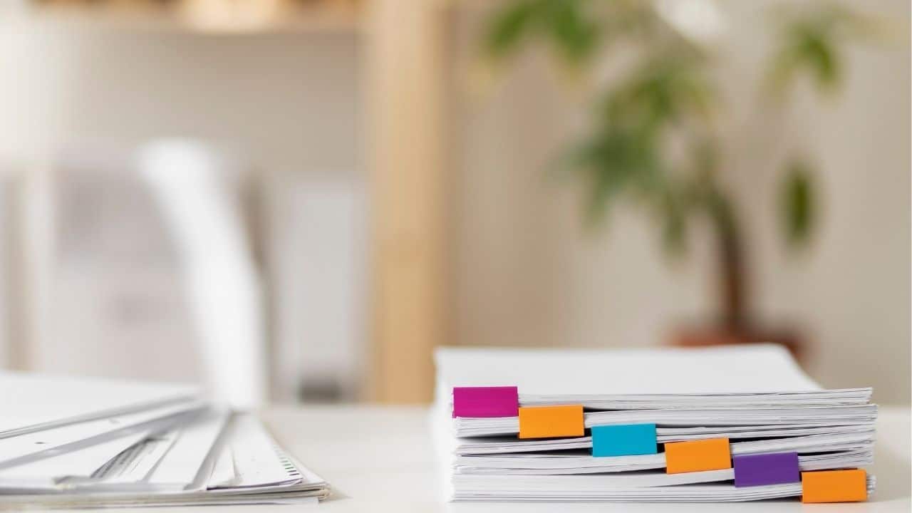 Documentation required for legal homeschooling in Thailand displayed on a table.