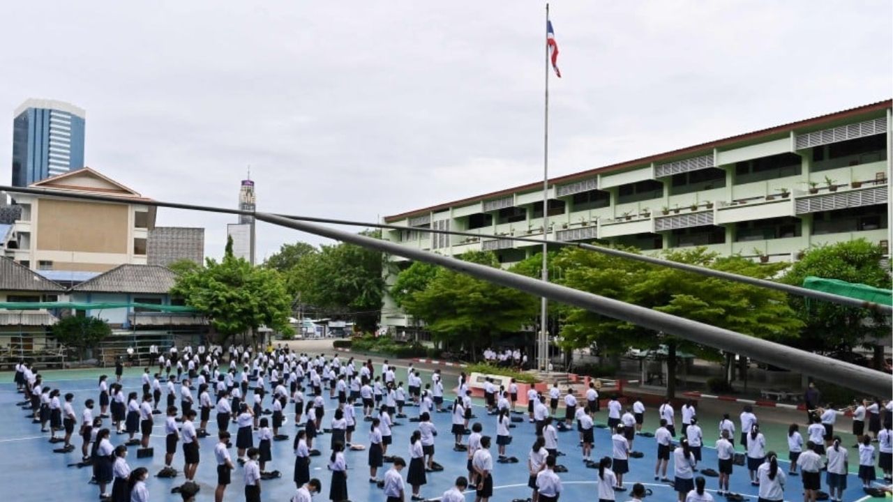 Students standing at attention at the morning assembly of the Flag Raising Ceremony | Photo taken from AFP pic