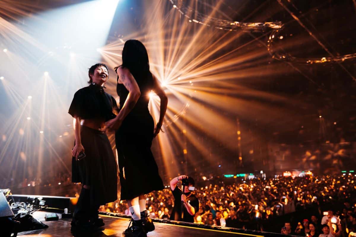 Juliet Fox and Meguru performing energetically on stage at 808 Festival.