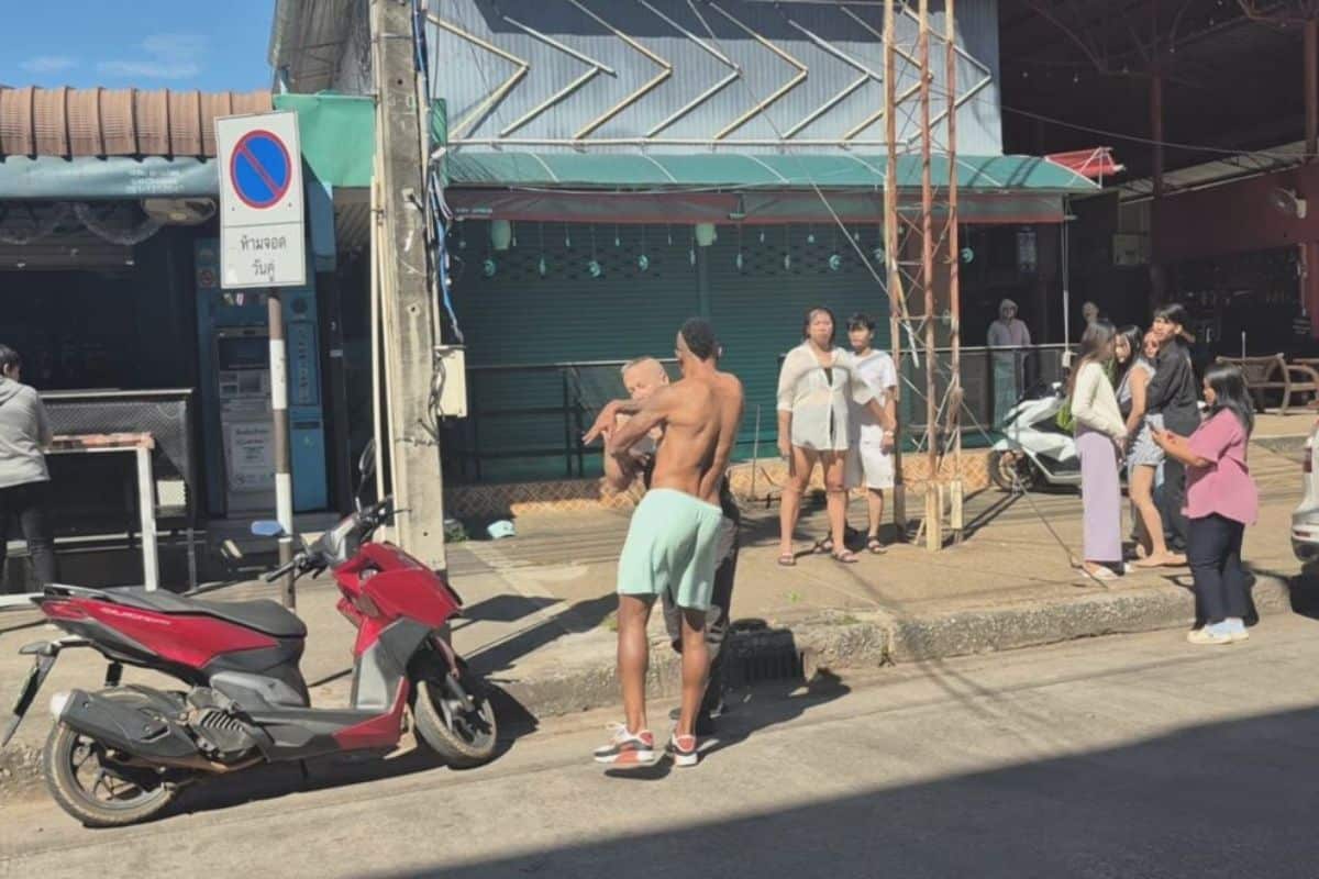 Bar staff surround Brazilian footballer Osvaldo Dos Santos Neto during a fight outside a bar in Udon Thani