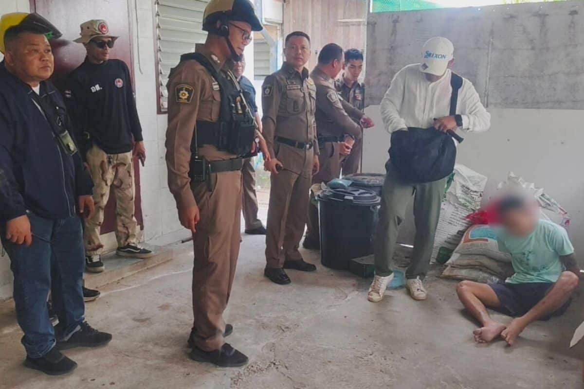 Rescue workers assist an injured prison escapee at Sikhio Police Station in Nakhon Ratchasima after a failed escape attempt.