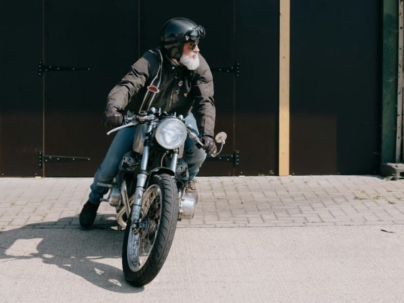 Old man on motorcycle, retirement visa in Thailand