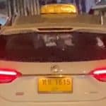 Foreign man slammed for leaning out of moving Phuket taxi | Thaiger