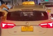 Foreign man slammed for leaning out of moving Phuket taxi | Thaiger
