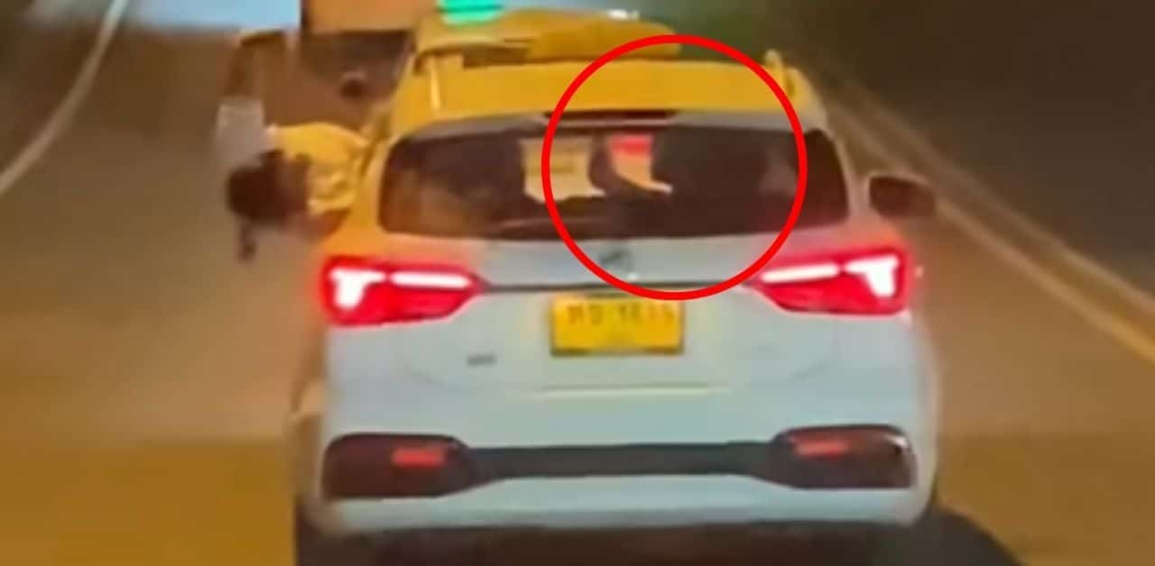 Foreign man sticks body out of Phuket taxi