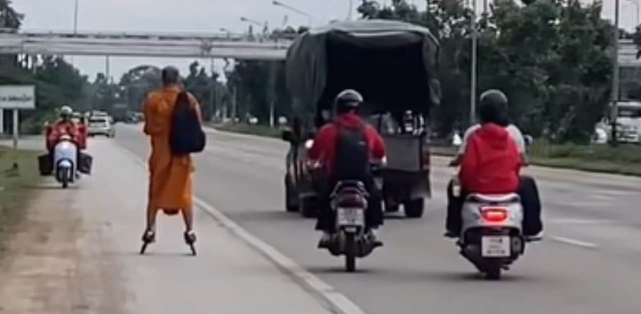 Thai monk on rollerblades