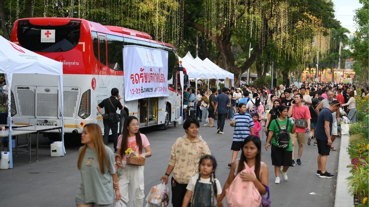 A blood donation truck at the Red Cross Fair encouraging charitable contributions.