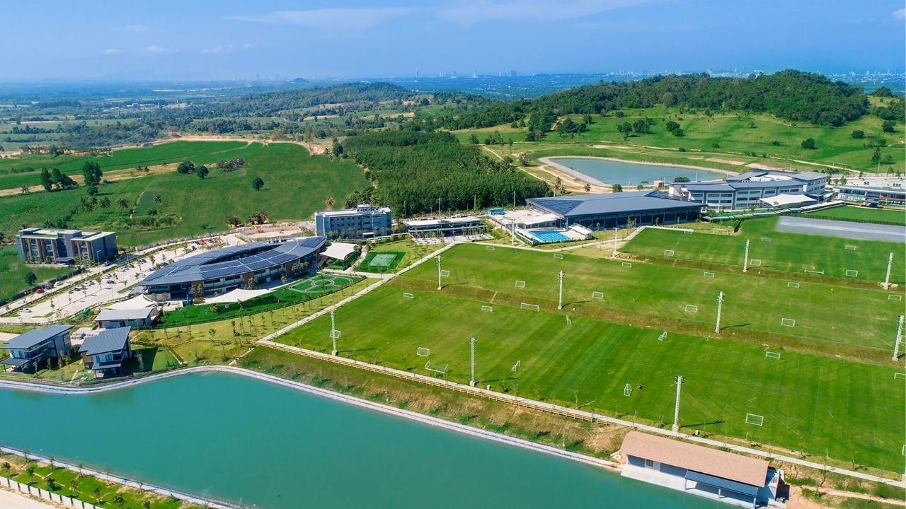 An aerial view of a modern boarding school campus in Thailand, highlighting its extensive facilities.