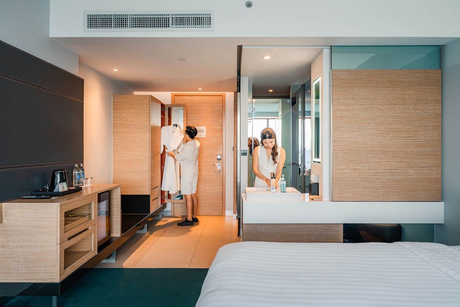 A man and woman at a hotel room