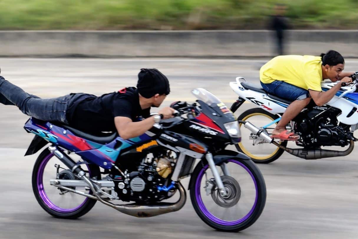 A group of dek waen, or cruising kids, showcasing their modified bikes in Thailand's vibrant racing culture.