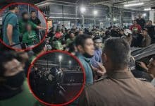 Delivery riders gather outside in mob police station after assault case | Thaiger