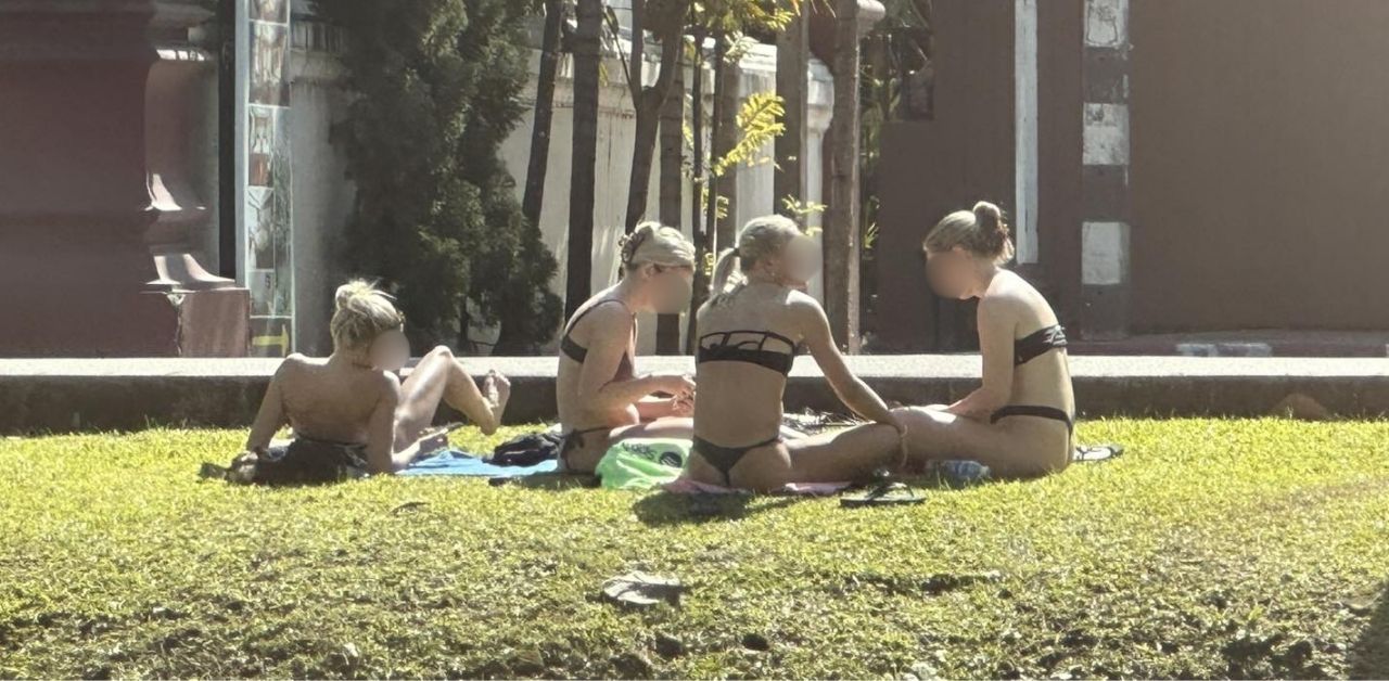 Opinions divided after foreigners sunbathe in bikinis near Chiang Mai temple | Thaiger