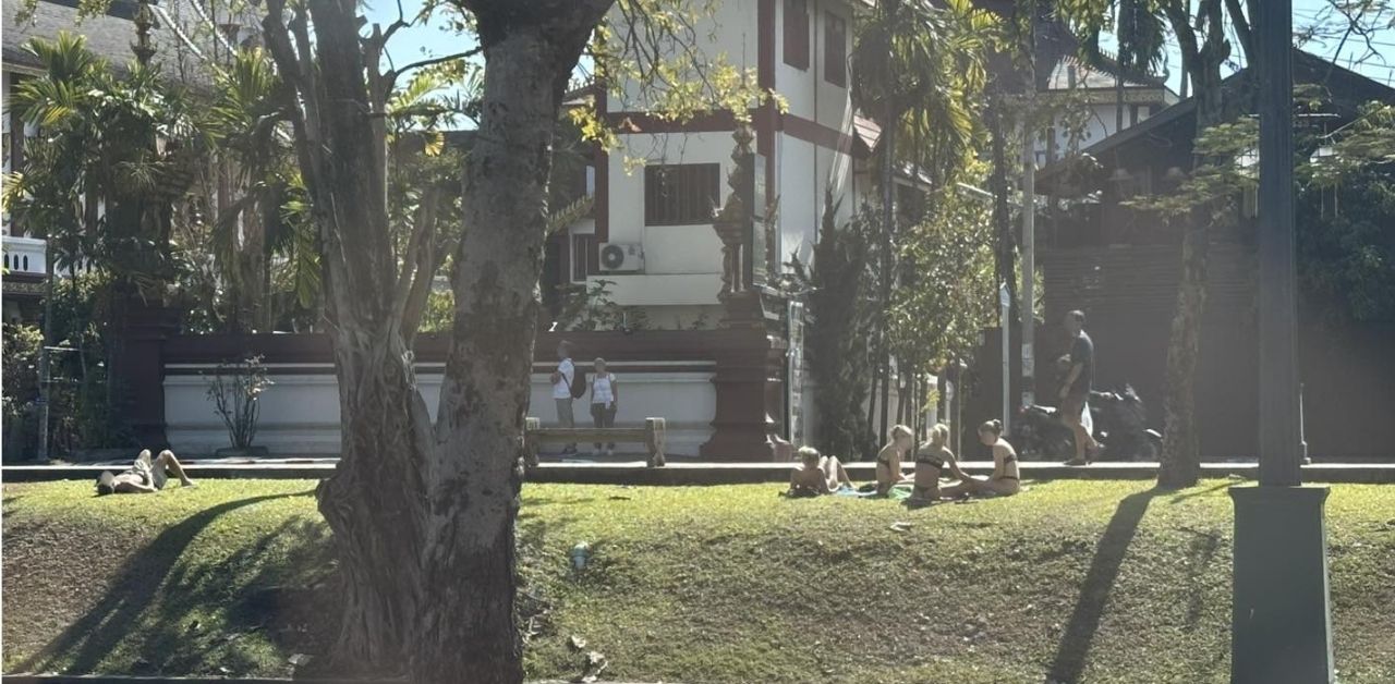 Foreign women sunbathe in bikinis bear temple sparking debate