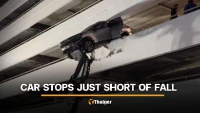 Thai driver escapes serious injury as SUV hangs off parking building | Thaiger