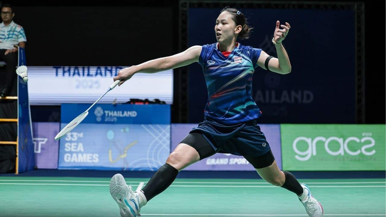 A vibrant badminton tournament in Thailand attracts crowds, illustrating the sport's growing fanbase and engagement.