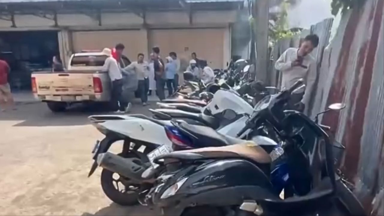 Damaged sedan and motorcycles at water factory in Trat after crash involving elderly driver