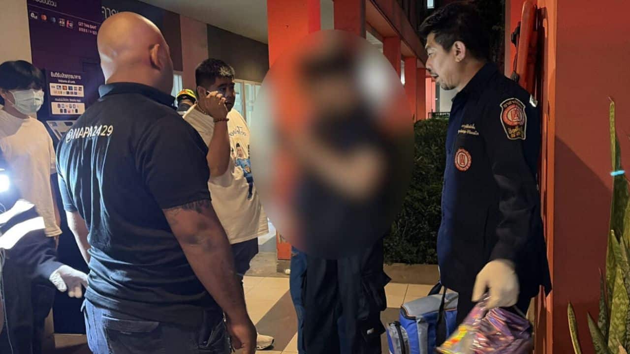 Rescue workers assisting stabbing victims at Samut Prakan condo