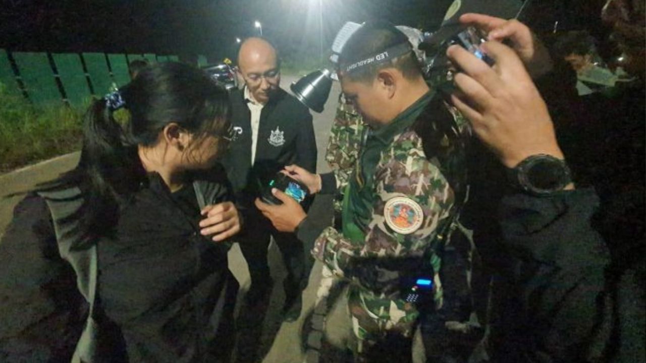 Wildlife officials vaccinate a female wild elephant with contraceptive in a forest in Trat, Thailand
