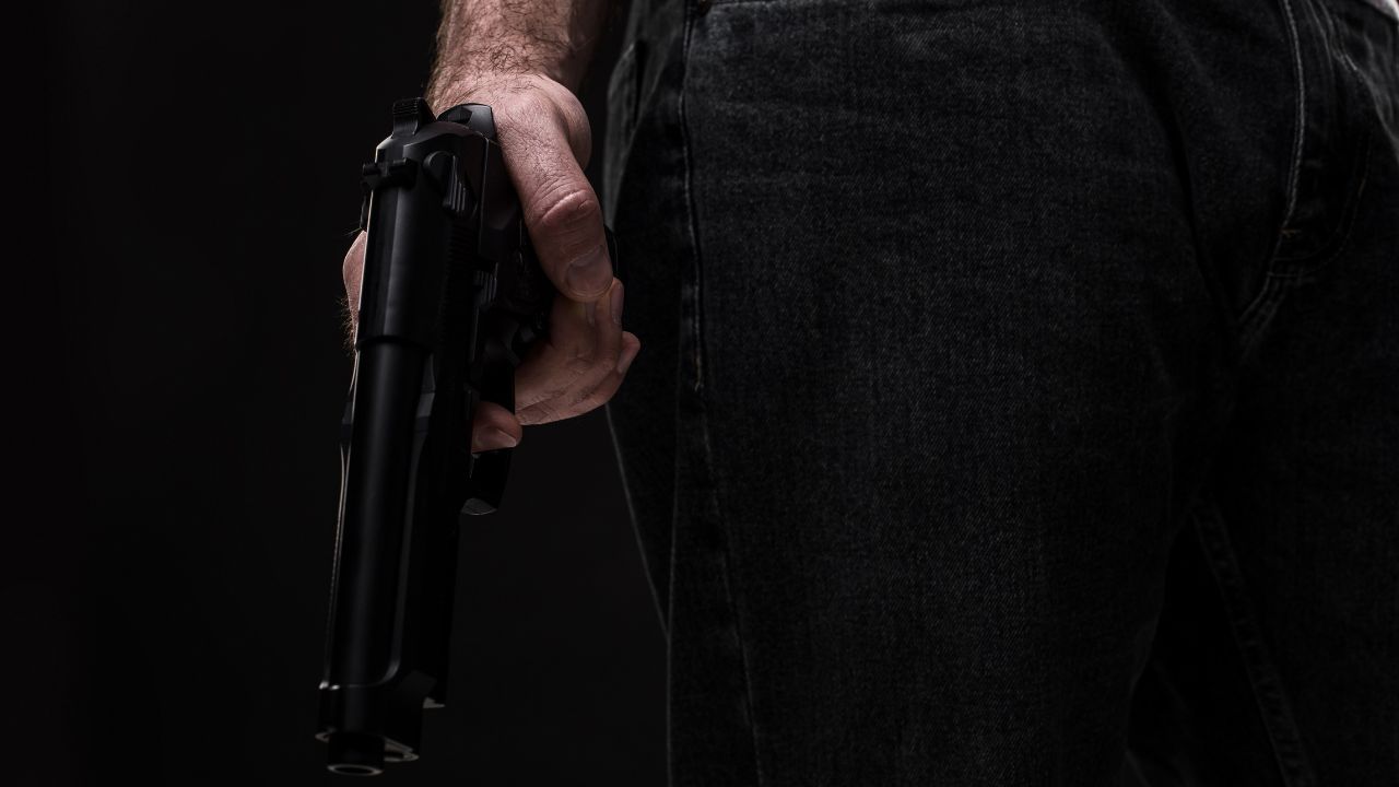 Hand holding a handgun