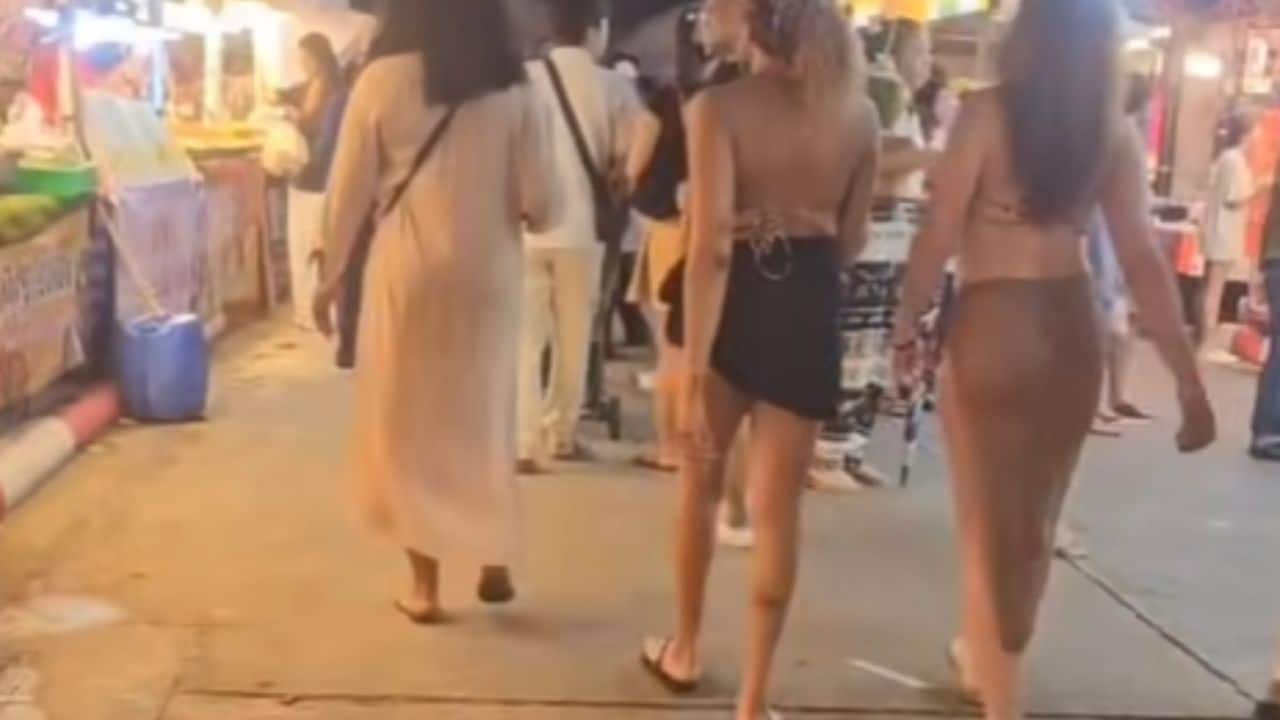 Opinions divided over foreign women in bikinis at temple fair in Phuket