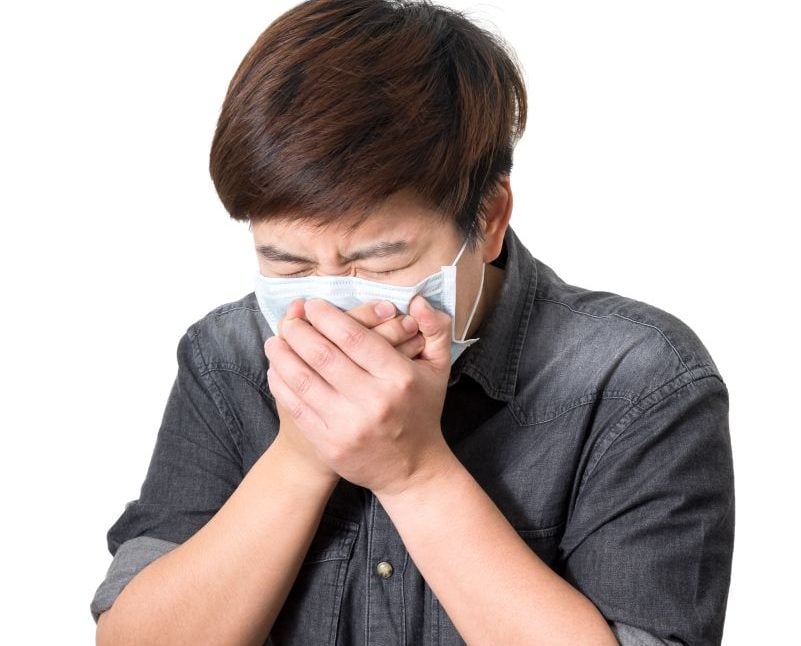 man coughing