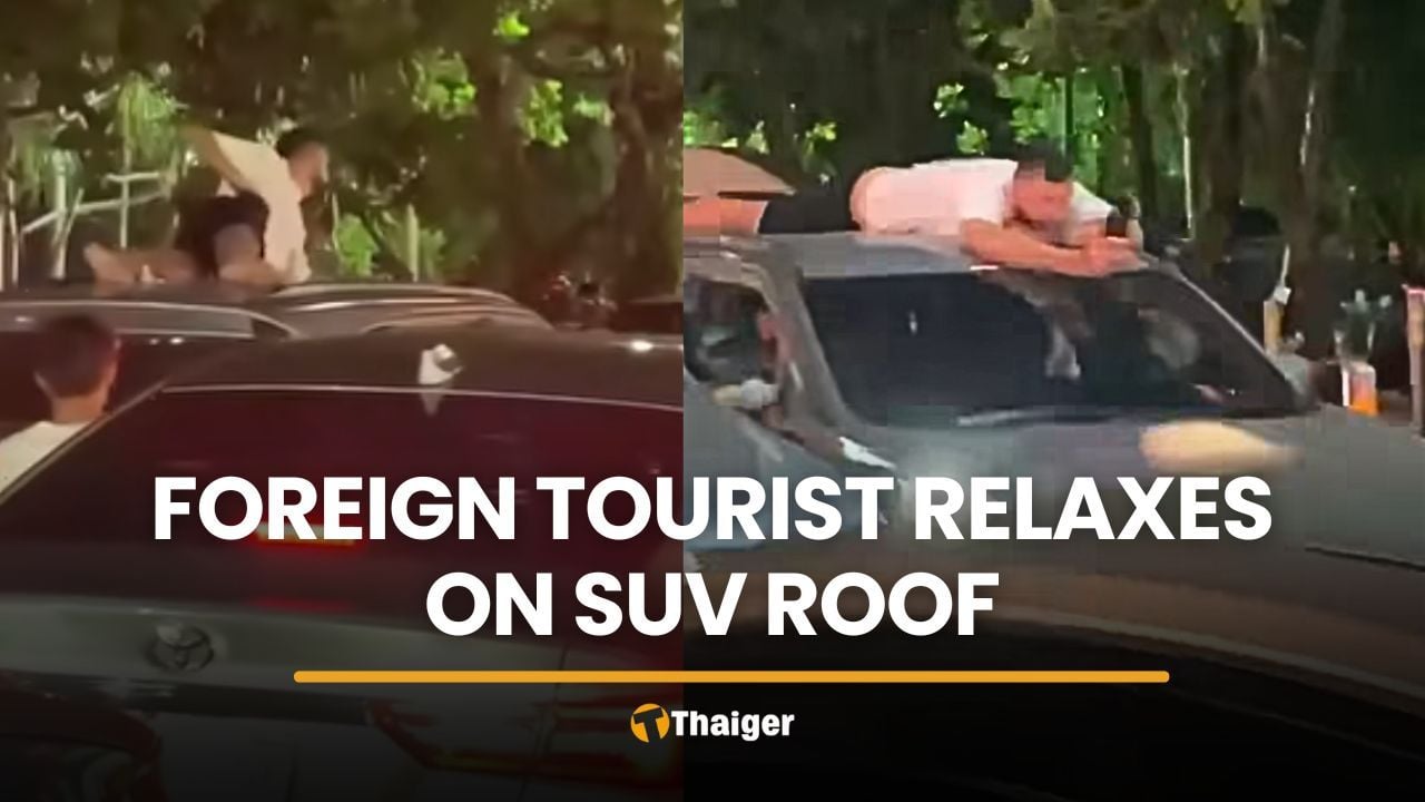 Foreigner seen relaxing on SUV roof during Phuket traffic | Thaiger