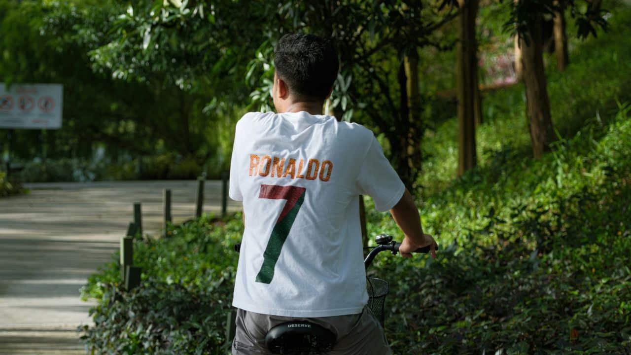 Man wearing a sports jersey with a number on the back