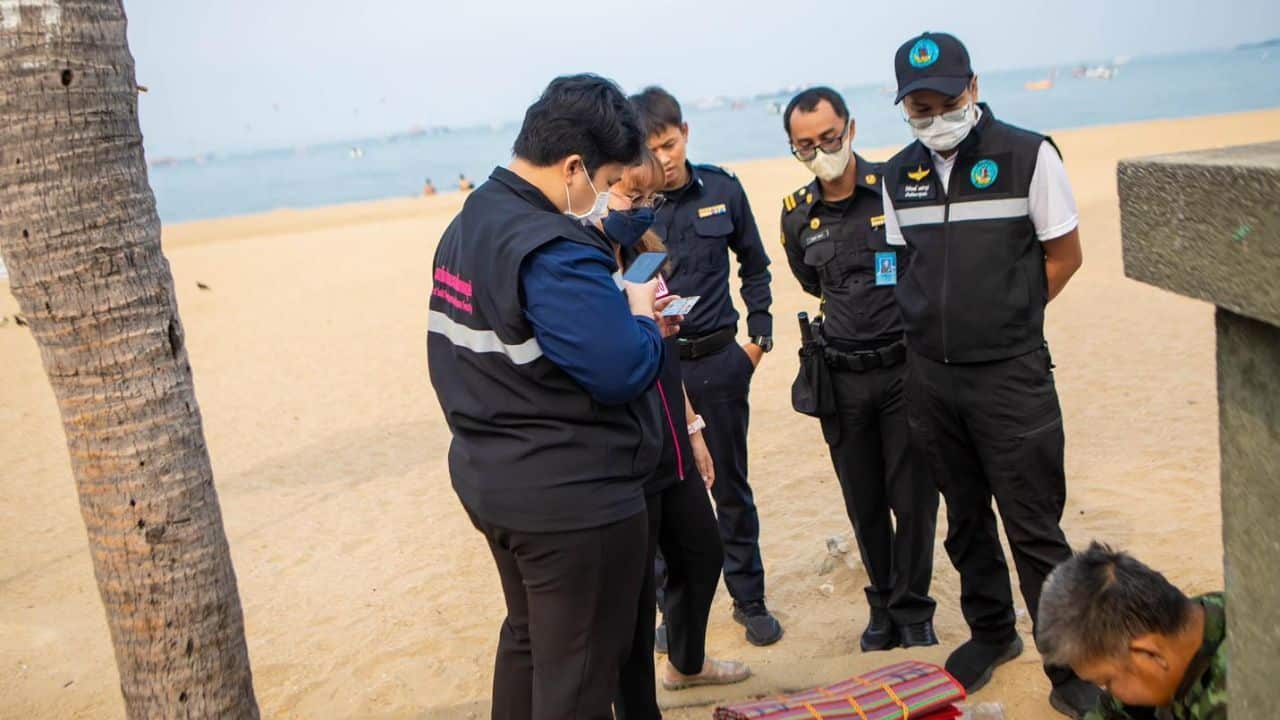 Pattaya City officials and social welfare teams patrol Pattaya Beach during a multi-agency operation.