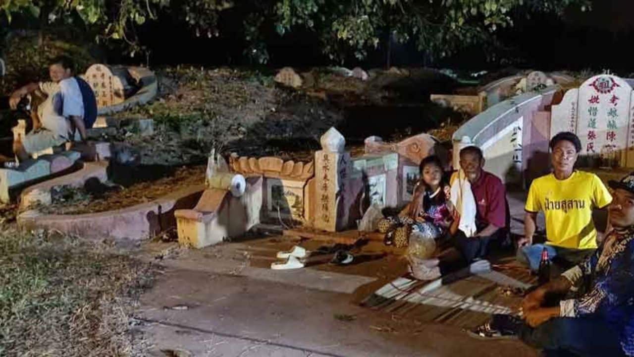 Phichit cemetery screens films for ancestors on Chinese New Year