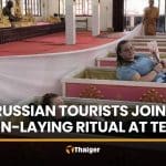 Russian tourists join coffin-laying ritual at Nakhon Nayok temple | Thaiger