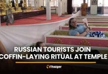 Russian tourists join coffin-laying ritual at Nakhon Nayok temple | Thaiger