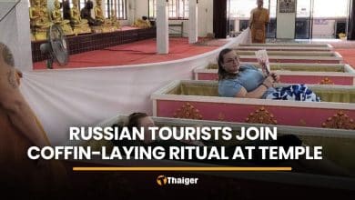 Russian tourists join coffin-laying ritual at Nakhon Nayok temple | Thaiger