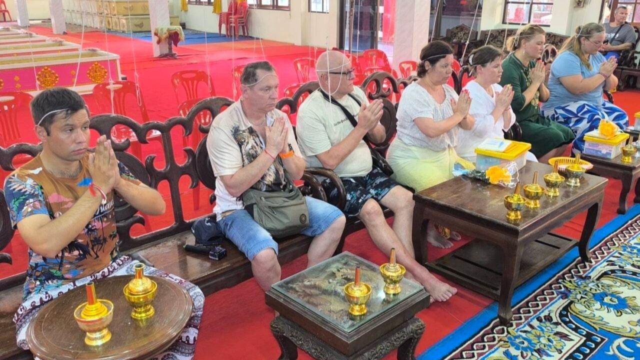 Russian tourists join coffin-laying ritual at Nakhon Nayok temple