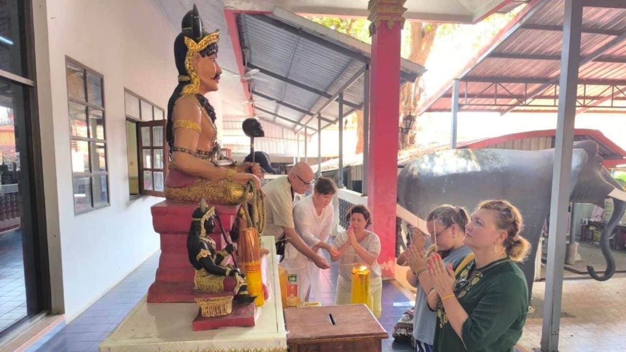 Russian tourists join coffin-laying ritual at Nakhon Nayok temple