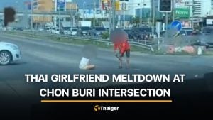 Chon Buri woman sits on road and throws shoes after argument with boyfriend | Thaiger