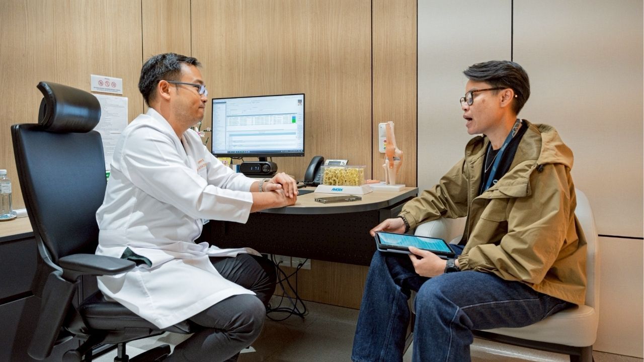 An orthopaedic trauma patient receives care from Dr. Pongsakorn, showcasing the healing process.