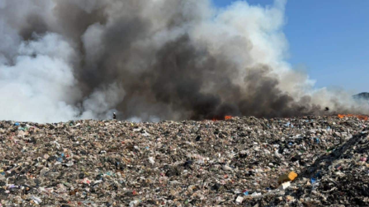 A landfill fire in Phuket has been contained, but smoke continues to rise from the waste site as officials urge residents to wear masks.
