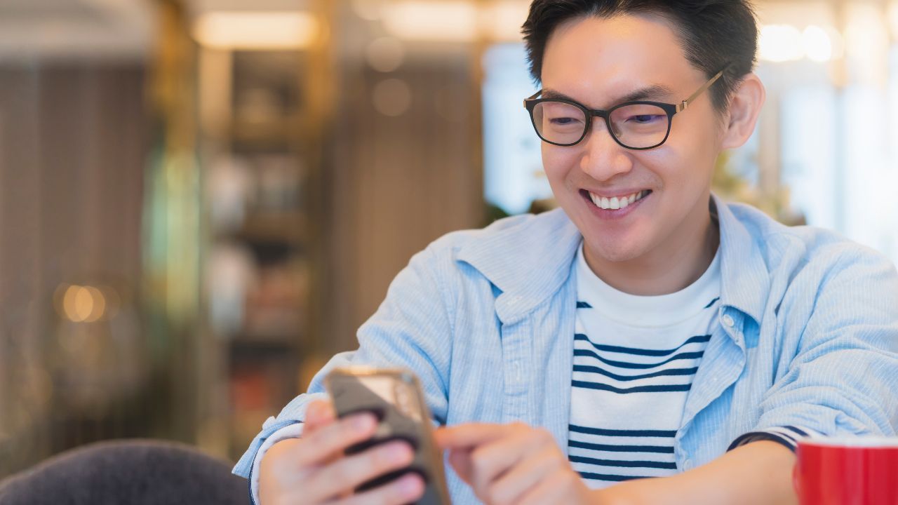 asian man using phone