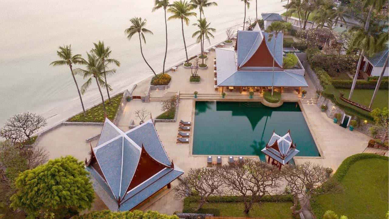 A serene beach in Thailand showcasing the growing travel trends focused on wellness and relaxation.