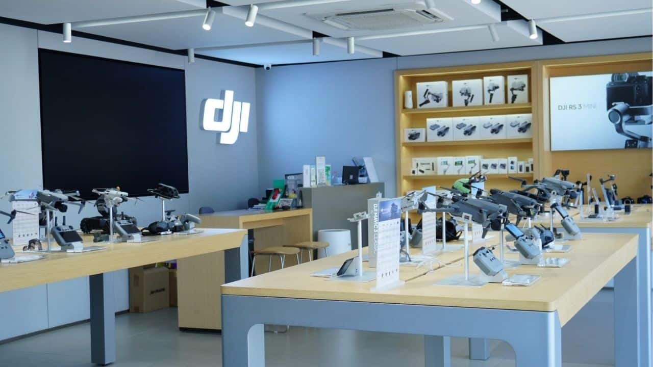 A drone displayed at a DJI store in Thailand, showcasing local purchase options.