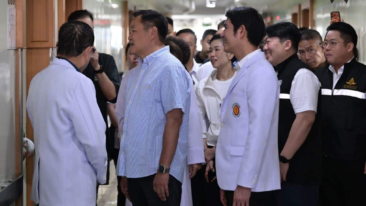 PM Anutin visits victims from bus train crash at hospital