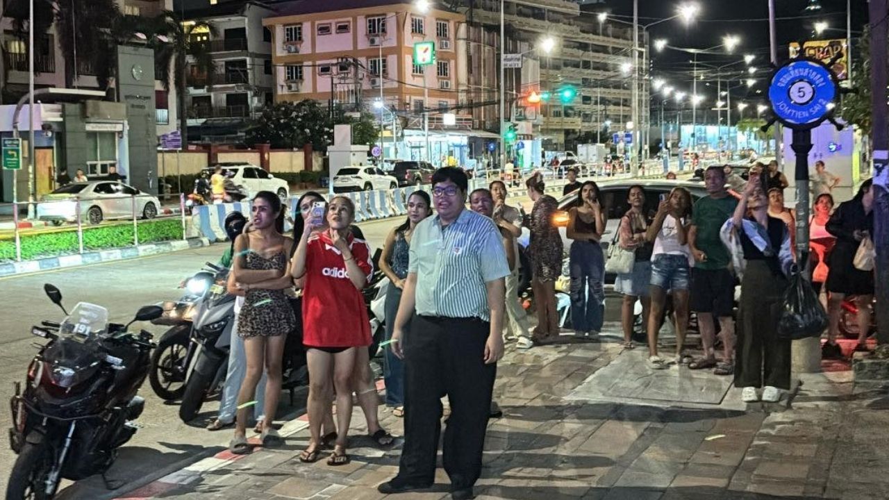 Crowd gathered to see body hanging over condo balcony in Pattaya
