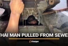 Rayong man removed from manhole after passerby hears cries for help | Thaiger
