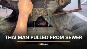 Rayong man removed from manhole after passerby hears cries for help | Thaiger