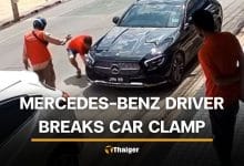 Mercedes-Benz driver flees after damaging police car clamp | Thaiger