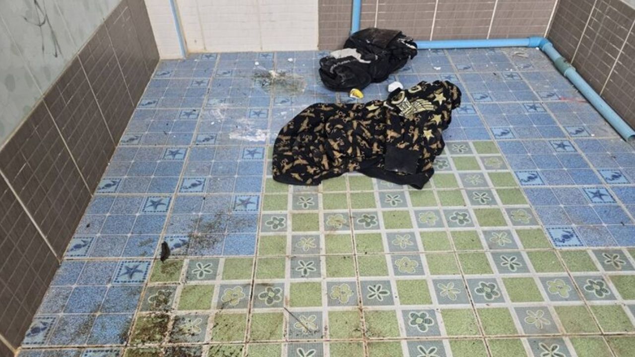 Police are working to identify a man found dead in a school toilet in Buriram, just days before students return for the new term.