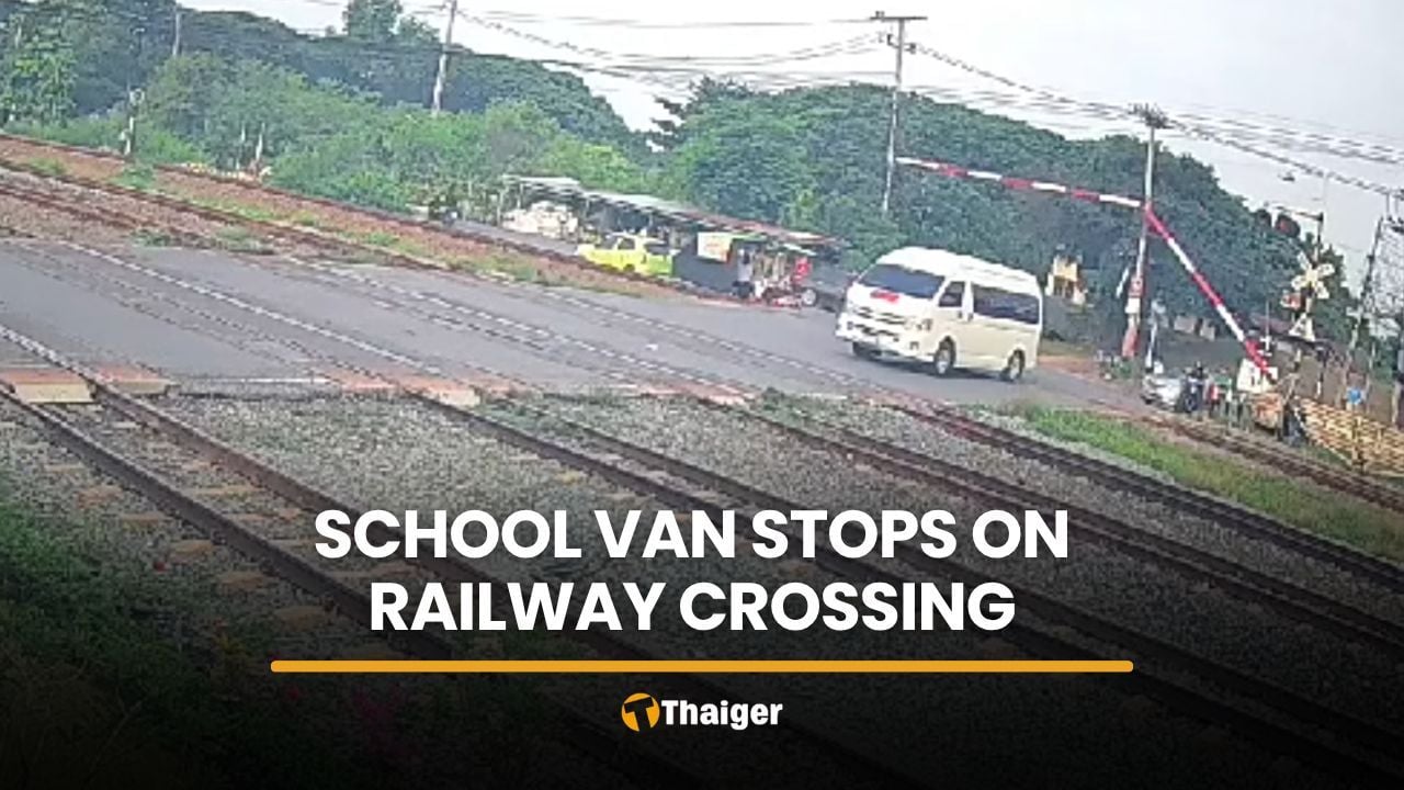 School van driver ignores barriers, stops on tracks as train approaches | Thaiger